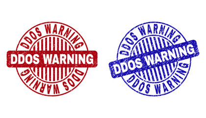 Grunge DDOS WARNING round stamp seals isolated on a white background. Round seals with distress texture in red and blue colors.