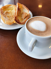 Brazilian breakfast. Bread toast with butter and coffee on a table.