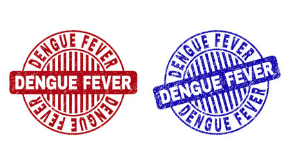 Grunge DENGUE FEVER round stamp seals isolated on a white background. Round seals with grunge texture in red and blue colors. Vector rubber imprint of DENGUE FEVER tag inside circle form with stripes.