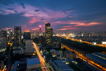 Fototapeta na wymiar sunset skyline with cityscape metropolis lighting up