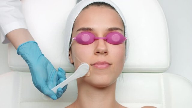 Top view of patient's face during applying ipl gel