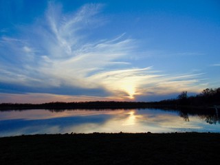 reflection of sunset on lake