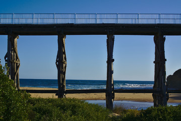 Wooden bridge with blue sky in background