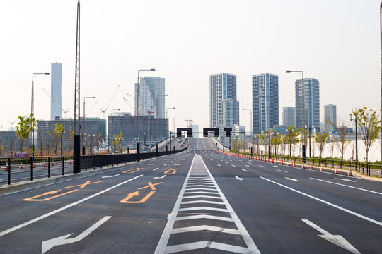 Toyosu, Tokyo, Japan, 04/06/2019 , View of Kanni-dori Avenue, with the incineration cimmey in Kachidoki, and hotel Mariners court tokyo.
