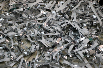 silver strips of foil and paper after children's paper show.