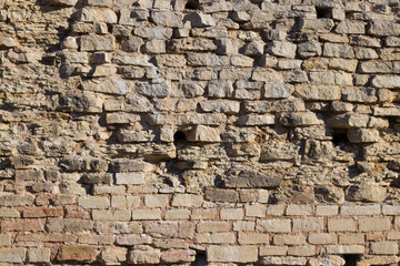 close view of the old stone brick wall of the castle