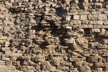 close view of the old stone brick wall of the castle
