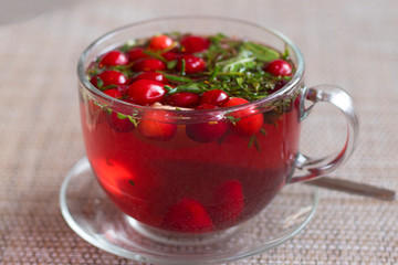 close view of a Cup of berry herbal tea. Tea of monks and centenarians.