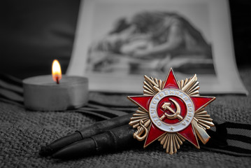  Soviet military order (Patriotic War), St. George ribbon, a burning candle on the background of...