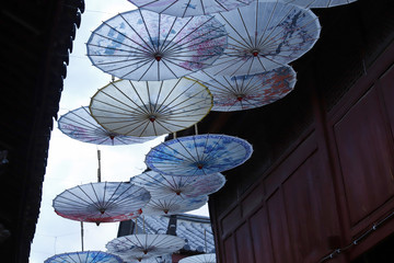 Umbrella-shaped decorations in a street of the ancient city of Lijiang, Yunnan, China