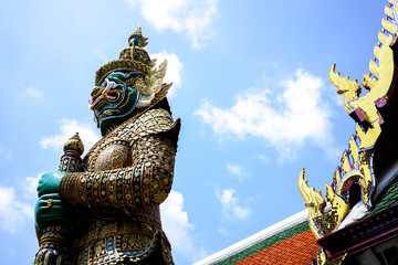 Big giant statue from Ramayana in Grand Palace Bangkok Thailand under clear sunny sky