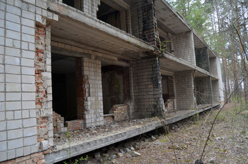 Fototapeta na wymiar Totally marauded and vandalised sanatorium near the road to Chernobyl Area. Kiev region. 