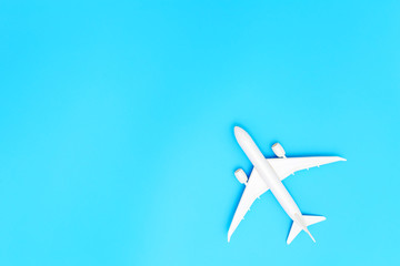 Model plane, airplane on blue pastel color background with copy space.Flat lay design.Travel concept on blue background. top view model plane on blue color background.