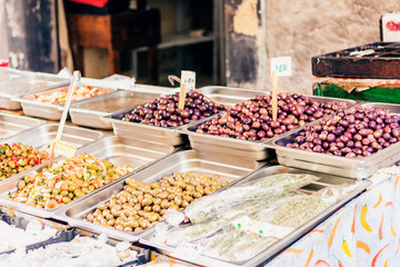 Green and black olives in the fruit market, Catania, Sicily, Italy.