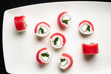 sushi with tuna on the white plate