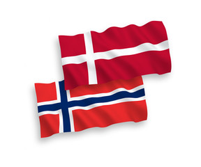 National vector fabric wave flags of Norway and Denmark isolated on white background. 1 to 2 proportion.