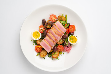 Salade niçoise on the white plate