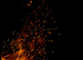 flame of fire with sparks on a black background