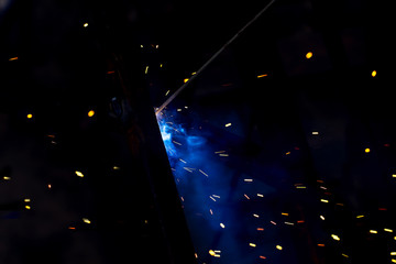flash of light with sparks on a black background