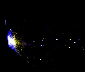 flash of light with sparks on a black background
