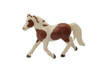 brown toy with white horse on a white background