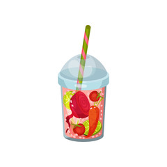 Cocktail with lime, beetroot, carrots and tomato in glass with straw.