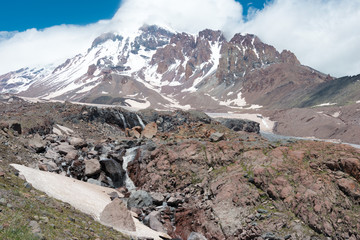 Fototapeta na wymiar Kazbegi, Georgia - Jun 29 2018: Mount Kazbek (5047m) at Gergeti Glacier. a famous landscape in Kazbegi, Mtskheta-Mtianeti, Georgia.