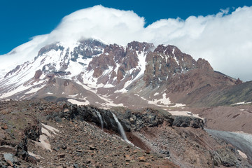 Fototapeta na wymiar Kazbegi, Georgia - Jun 29 2018: Mount Kazbek (5047m) at Gergeti Glacier. a famous landscape in Kazbegi, Mtskheta-Mtianeti, Georgia.
