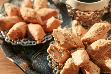 Turkish sweets with coffee on a wooden table