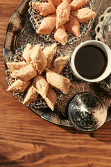 Turkish sweets with coffee on a wooden table