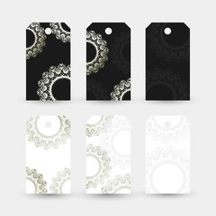 Silver rings in Asian style. Labels collection with ornaments on the white and black background.