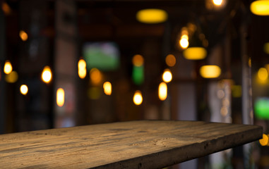 blurred background of bar and dark brown desk space of retro wood