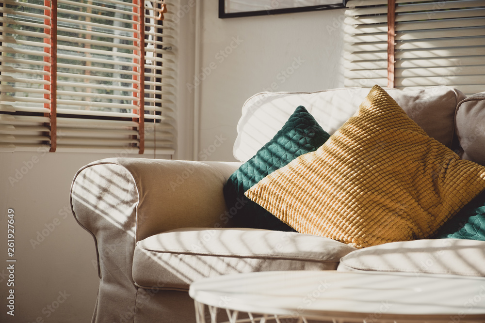 Poster close up pillow on sofa at home in morning with sunlight.furniture in house background with light sh
