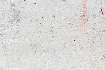 Wall fragment with scratches and cracks