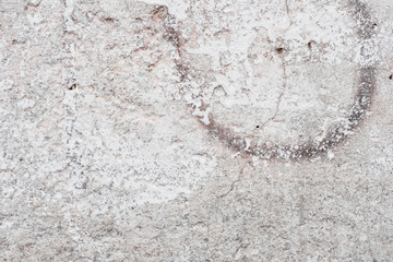 Wall fragment with scratches and cracks