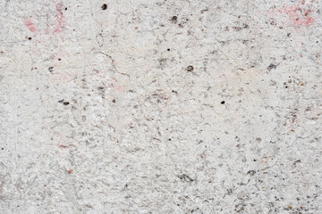 Wall fragment with scratches and cracks