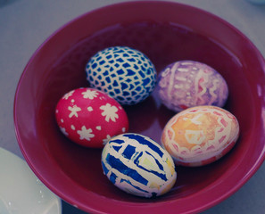 painted eggs on plate