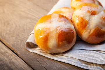 Hot cross buns on basket Top view, copy space. Easter baking