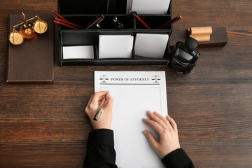 Female notary public working at table