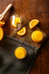 Tasty orange juice on wooden table