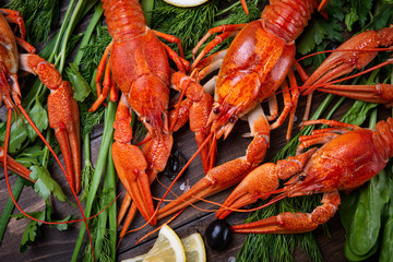 Crayfish. Red boiled crawfishes on table in rustic style, closeup. Lobster closeup.