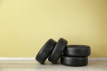 Car tires near color wall