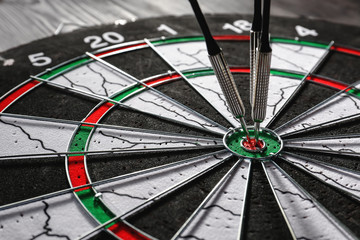 Dartboard with hit bullseye, closeup