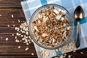 Oatmeal with cottage cheese, honey, peanut and sunflower seeds.