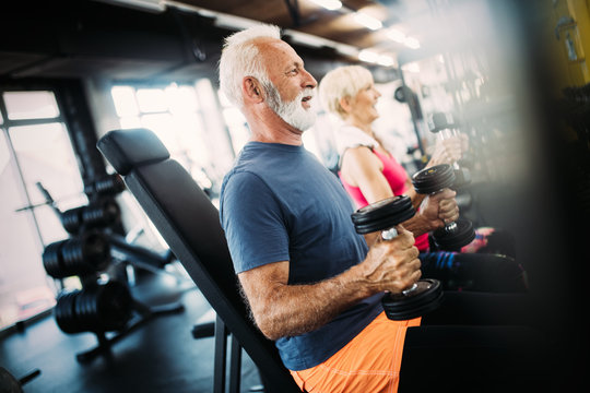 Senior man at the gym doing exercise to stay healthy