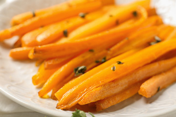 Tasty cooked carrot on plate, closeup
