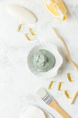 home made spa cosmetic with citrus, volcanic clay, soap, essential oil on white gray background top view, organic natural hegiene cosmetic concept