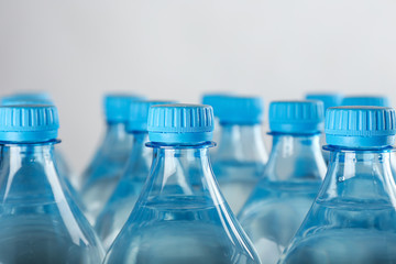 Bottles of water on light background