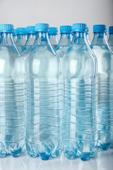Bottles of water on light background