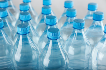 Bottles of water on light background
